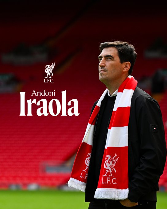 A picture of Andoni Iraola wearing a Liverpool scarf at Anfield